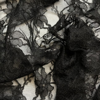 Black 55% Polyamide 45% Cotton corded floral Lace. Double scalloped selvedges