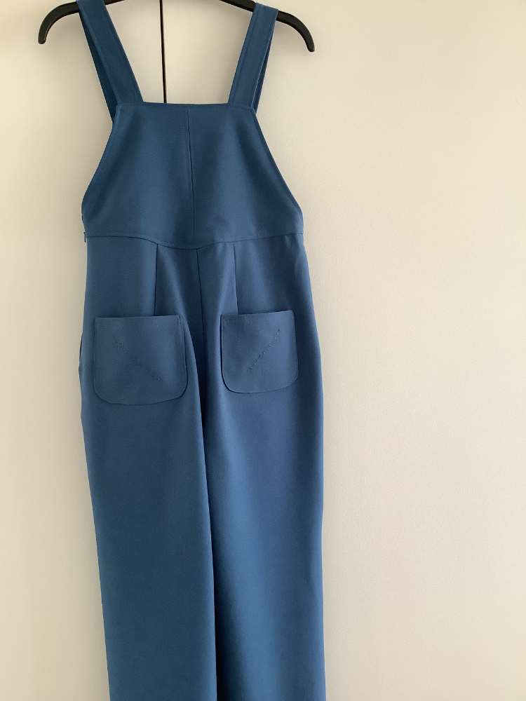 back view of blue stretch poly viscose suiting dungarees