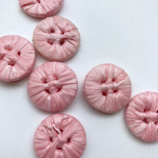 Pink raffia covered 4 hole button