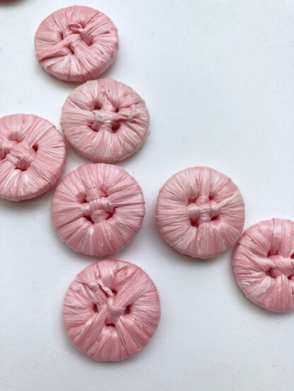 Pink raffia covered 4 hole button