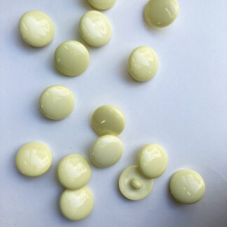 Lemon Yellow smarties type shiny plastic domed shank button