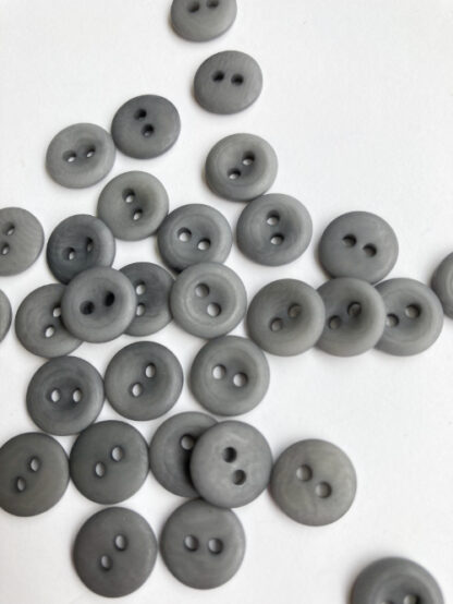 Mid Grey corozo nut 2 hole button with thumb dent