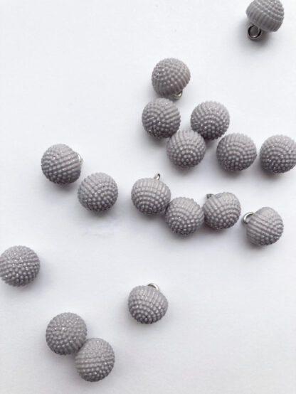 Light Grey sparkly plastic dome button on shank