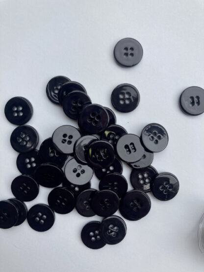 Black faux shell glossy plastic 2 hole flat button