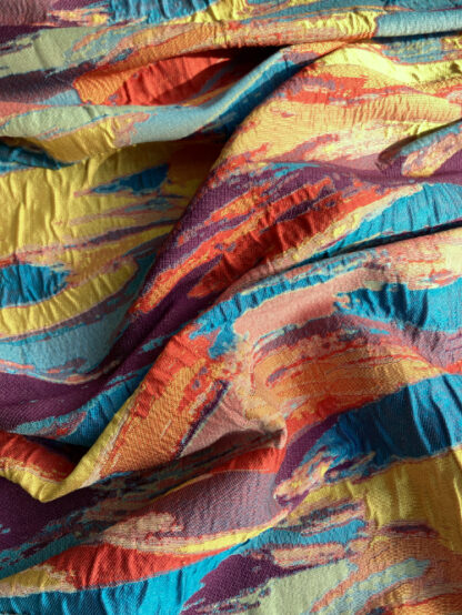 Red, Turquoise, Yellow, Purple Multicolour abstract design 98% Polyester 2% Elastane Cloqué Brocade Suiting (elastane content provides texture not stretch)