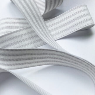 White 60% Polyester 40% Rubber sport elastic -great fold resistant elastic for enclosed waistbands and can be sewn through in channels if desired. 