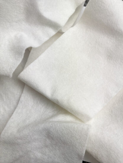 Ivory 50% Wool 50% Viscose felted/ compressed natural fibre sew-in batting for quilted jackets and waistcoats. A natural alternative to Vilene's Thermolam