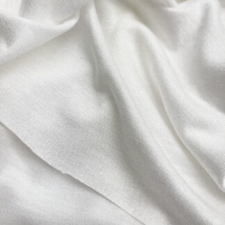 Ivory  knitted Jersey 100% Viscose medium / heavy iron-on interfacing. Use for stabilising heavier jerseys and knits, and anything which needs a substantial stretch interfacing 