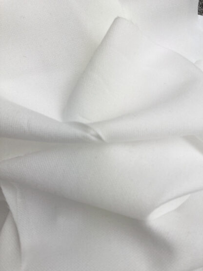 Ivory Polyamide and Elastane medium weight stretch knitted speed tailoring iron-on interfacing 