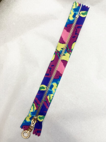 Psychedelic abstract rainbow purple, pink, lime printed fancy metal 7” zip