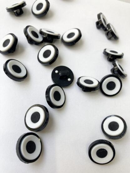White with Black centre 'target', and rim moulded Plastic button on shank