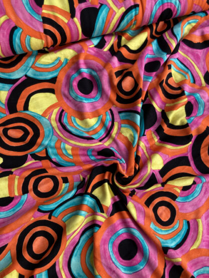 Fuchsia Pink, Orange, Yellow and Jade Green multicolour circles geometric print 95% Viscose 5% Elastane lightweight Jersey 75% stretch