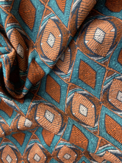 Terracotta and Turquoise Indonesian tribal geo print 100% Cotton Seersucker Piqué