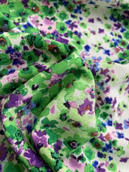 Green and lilac ditsy floral print polyester crepe