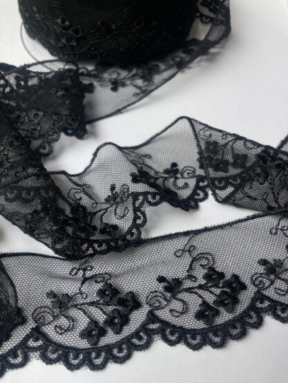 black spriggy floral design scalloped soft lace