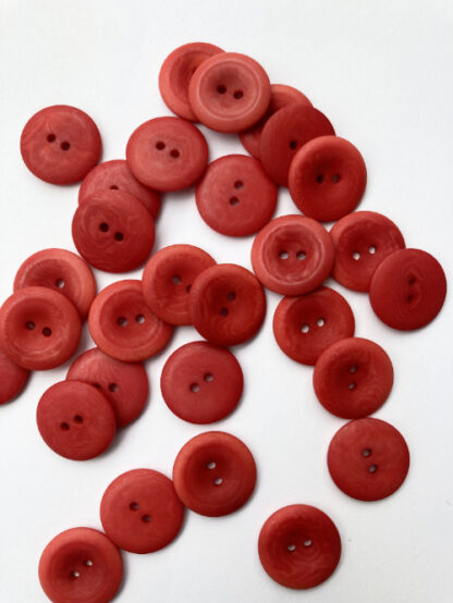 Red corozo (Tagua nut/vegetable ivory) 2 hole wooden button with thumb dent