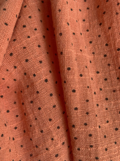 Pumpkin Orange  with black small irregular spots 100% Cotton Cheesecloth